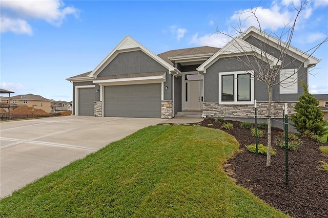 view of front facade with a garage and a front yard