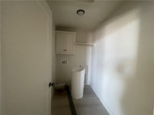 laundry room with laundry area, washer hookup, and baseboards