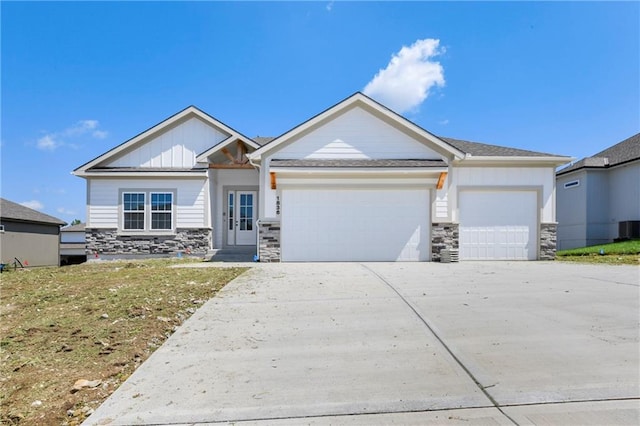 view of front of property featuring a garage and a front lawn