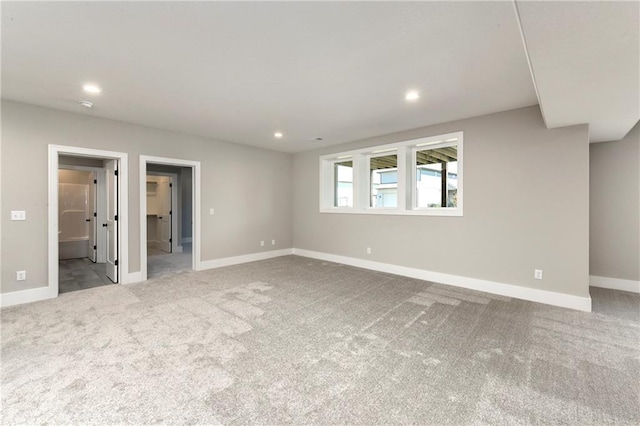 carpeted spare room with baseboards and recessed lighting