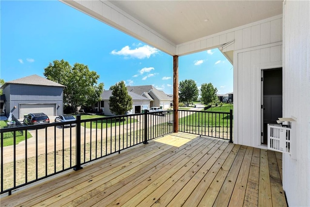 deck with a residential view, a grill, and a yard