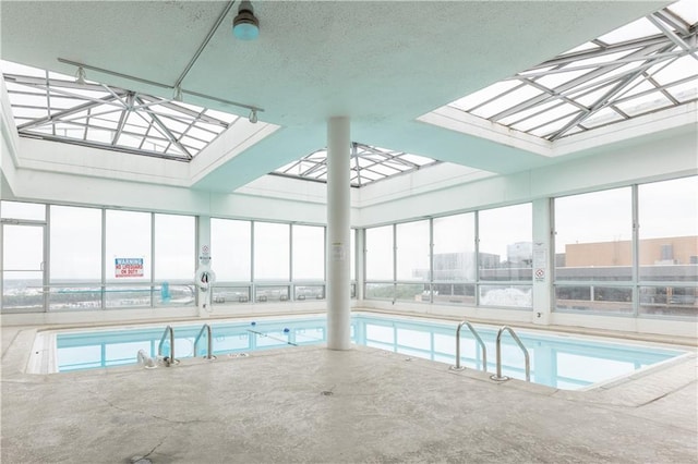 view of pool with a skylight