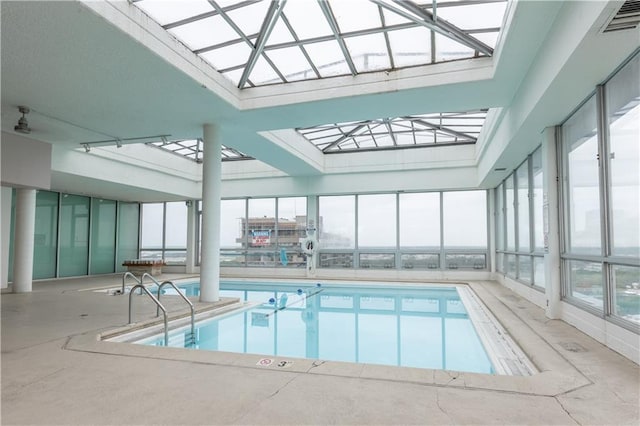 view of swimming pool with a skylight