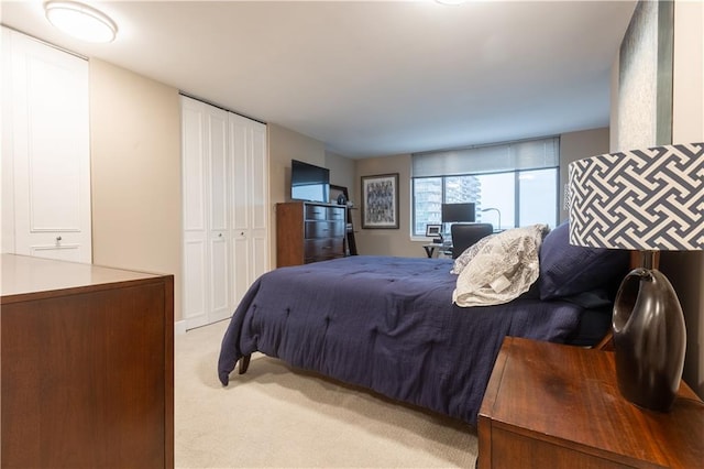 bedroom with light carpet