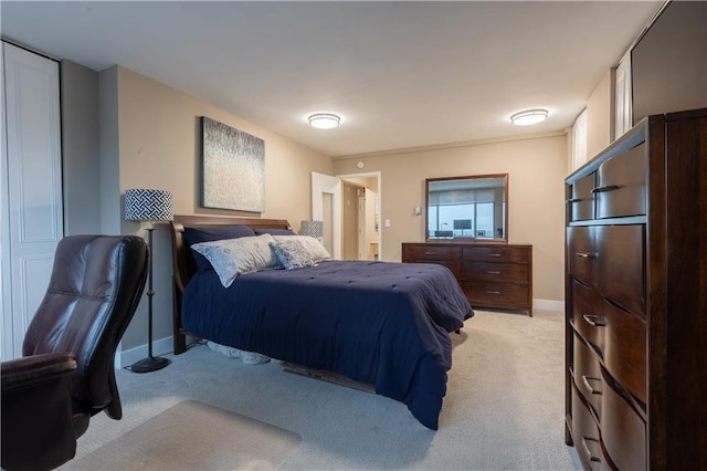 bedroom with light colored carpet