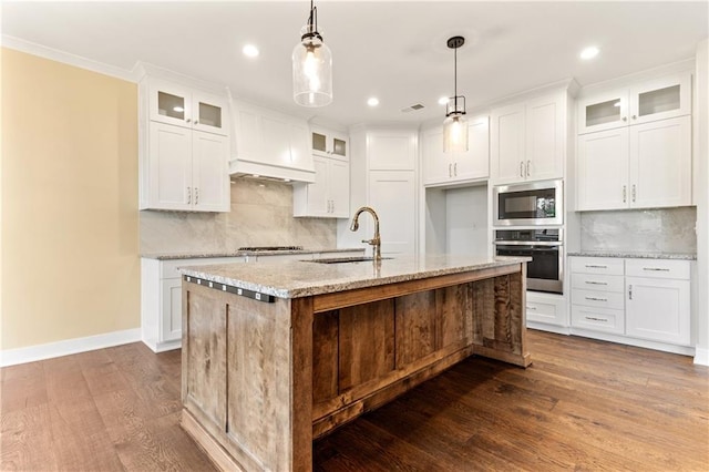 kitchen with white cabinets, sink, stainless steel appliances, and dark wood-type flooring