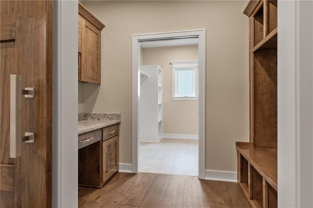 interior space with parquet floors and light stone counters