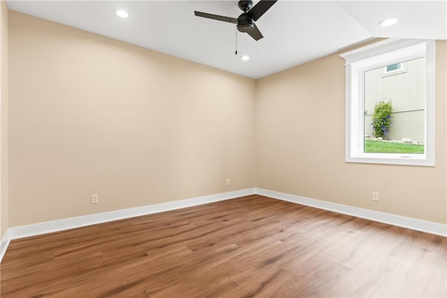 empty room featuring ceiling fan and hardwood / wood-style flooring