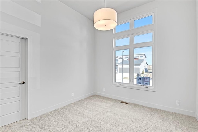 empty room featuring light colored carpet