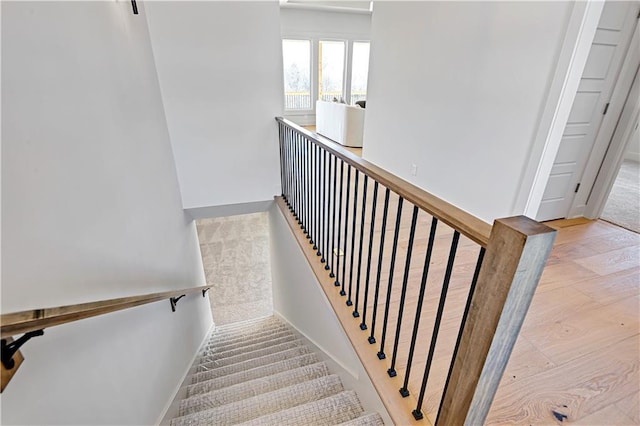 22051 W 100th Ter, Lenexa, KS 66220 - stairs with wood finished floors and baseboards