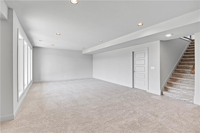 22051 W 100th Ter, Lenexa, KS 66220 - basement with carpet floors, recessed lighting, stairway, and baseboards