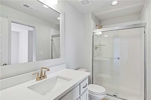 22051 W 100th Ter, Lenexa, KS 66220 - full bathroom with vanity, toilet, a stall shower, and recessed lighting