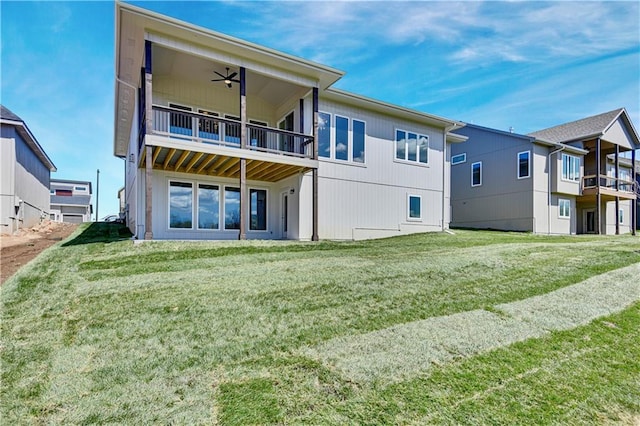 22051 W 100th Ter, Lenexa, KS 66220 - back of property featuring a lawn, a ceiling fan, and a balcony