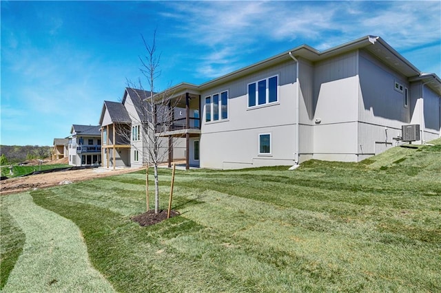 22051 W 100th Ter, Lenexa, KS 66220 - back of house with a yard and central air condition unit