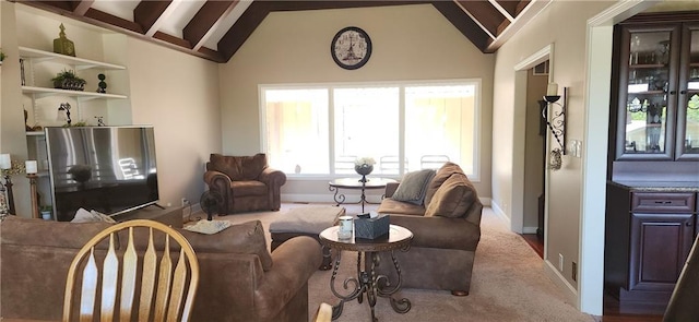 living room featuring carpet flooring and vaulted ceiling