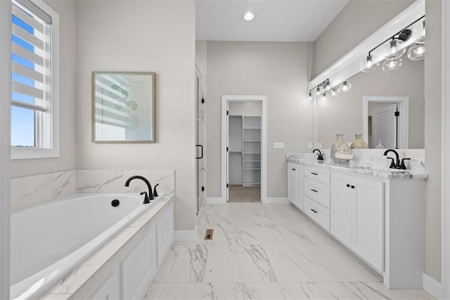 bathroom featuring vanity and separate shower and tub