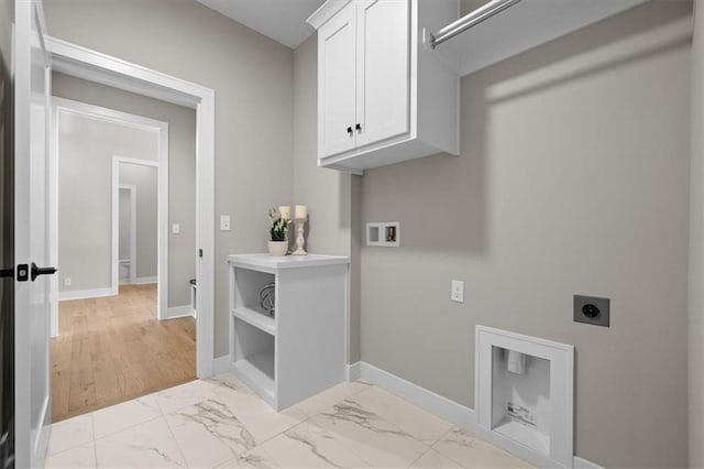 laundry room featuring cabinets, washer hookup, and hookup for an electric dryer