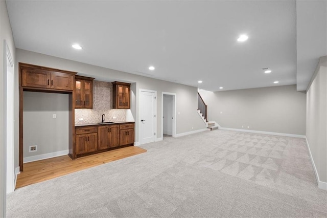 interior space with light colored carpet and sink