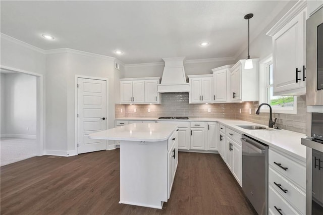 kitchen featuring decorative backsplash, stainless steel dishwasher, dark hardwood / wood-style floors, custom range hood, and sink