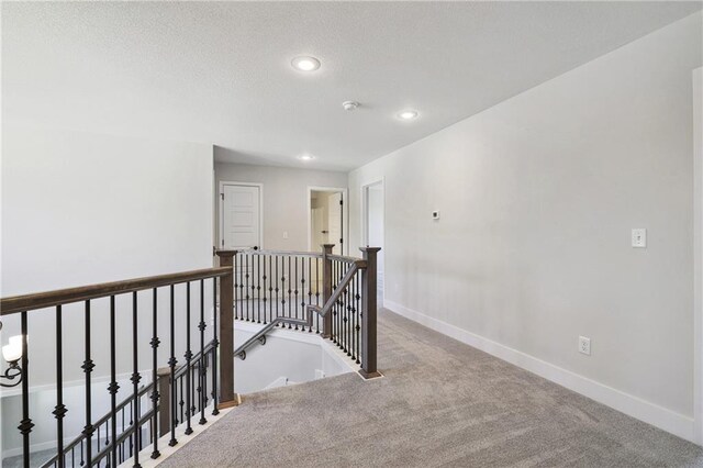 hallway with carpet