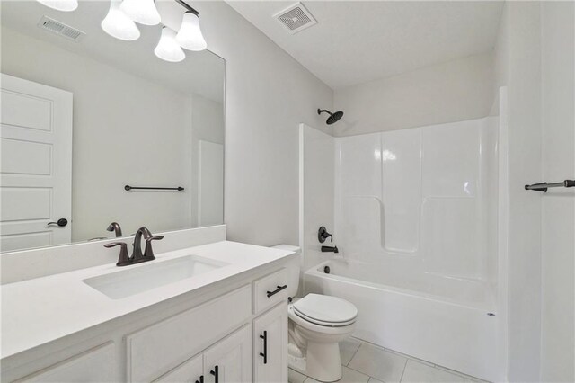 full bathroom with tile patterned flooring, toilet, vanity, and shower / bath combination