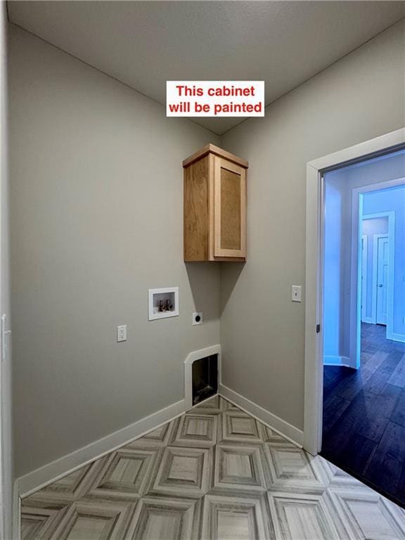 laundry area featuring cabinets, hookup for a washing machine, and hookup for an electric dryer