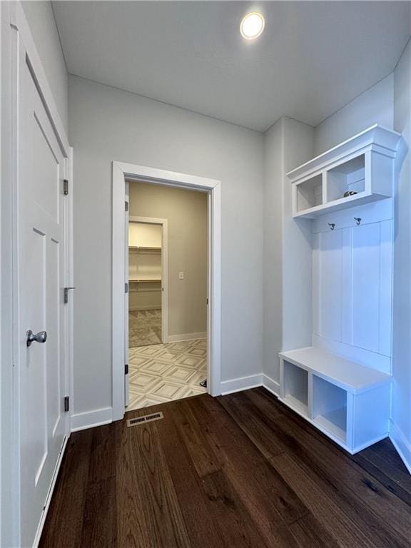 mudroom featuring dark wood-type flooring