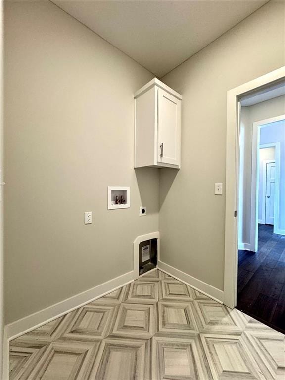 laundry area with baseboards, cabinet space, hookup for an electric dryer, and washer hookup