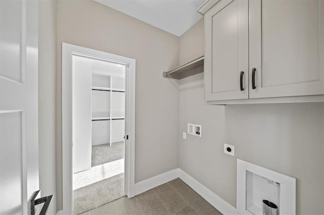 laundry area with cabinets, hookup for a washing machine, and electric dryer hookup