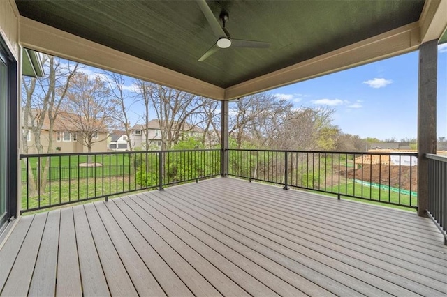 wooden deck featuring ceiling fan