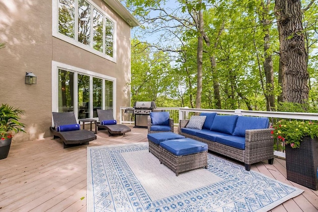 wooden deck featuring area for grilling and outdoor lounge area