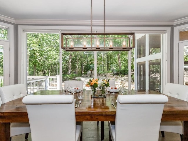 dining room featuring crown molding