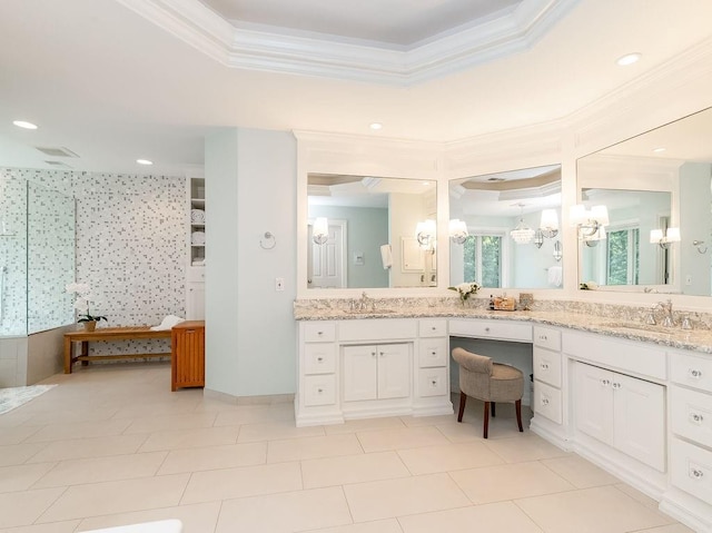 bathroom featuring vanity, crown molding, a raised ceiling, and walk in shower