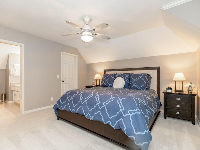 bedroom with ceiling fan, lofted ceiling, carpet flooring, and ensuite bath