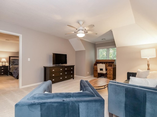 carpeted living room featuring crown molding, ceiling fan, and vaulted ceiling