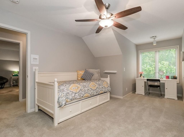 carpeted bedroom featuring lofted ceiling and ceiling fan