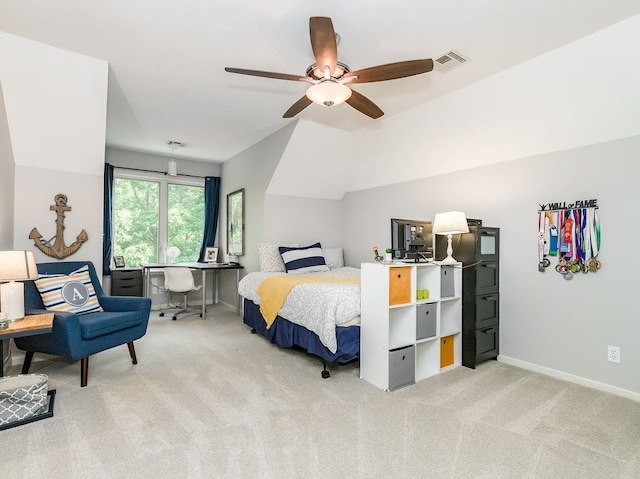 carpeted bedroom with ceiling fan and lofted ceiling