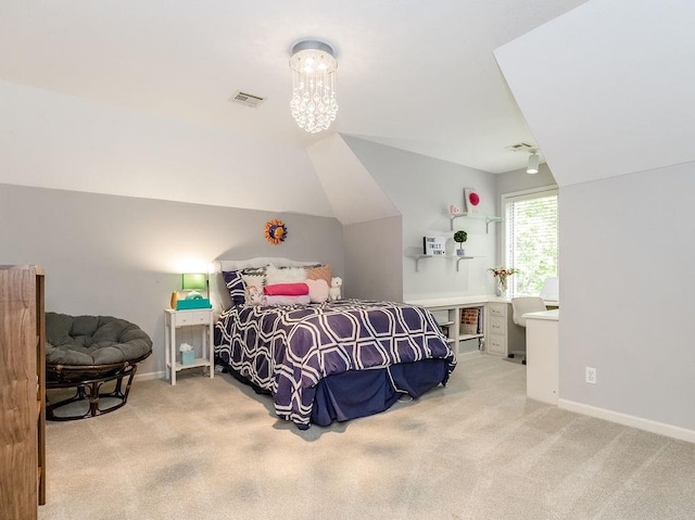 carpeted bedroom with lofted ceiling and a notable chandelier