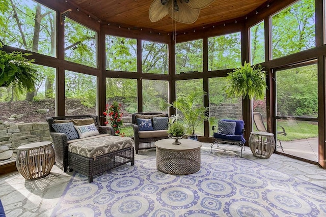 sunroom / solarium with ceiling fan and wooden ceiling