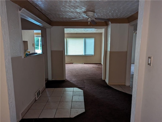 hallway featuring light colored carpet