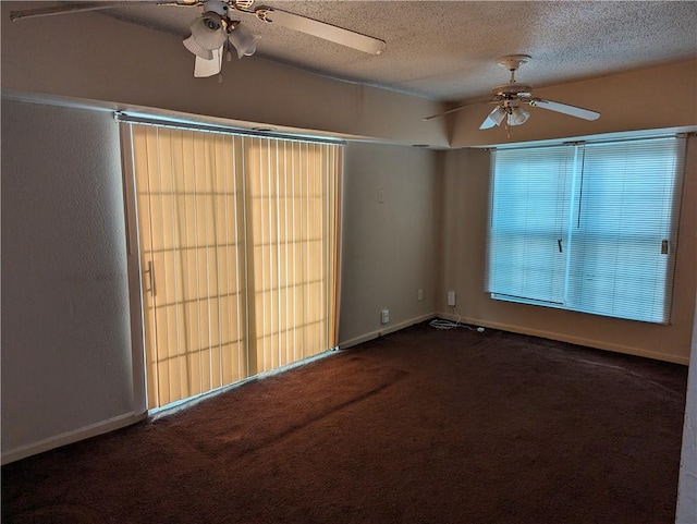 carpeted spare room with ceiling fan and a textured ceiling