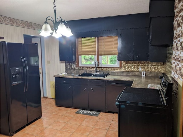 kitchen featuring decorative light fixtures, black appliances, an inviting chandelier, sink, and tasteful backsplash