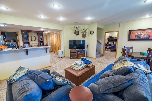 carpeted living room with washer / clothes dryer