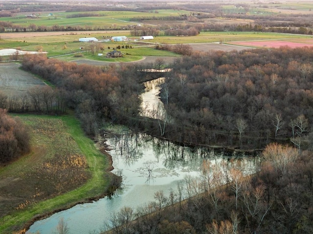 drone / aerial view featuring a rural view and a water view