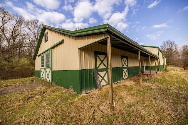 view of home's exterior with an outdoor structure