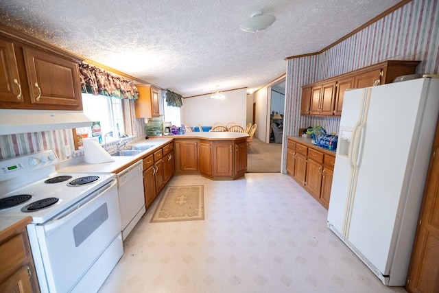 kitchen with custom exhaust hood, a textured ceiling, sink, white appliances, and kitchen peninsula