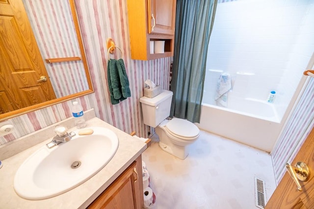 full bathroom with vanity, toilet, and shower / bath combo with shower curtain