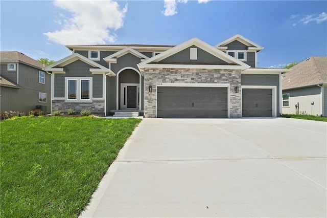 craftsman inspired home with a garage, stone siding, a front lawn, and driveway