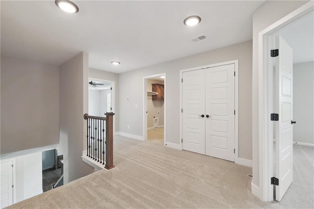 corridor featuring carpet floors