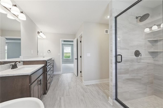 bathroom with vanity and walk in shower